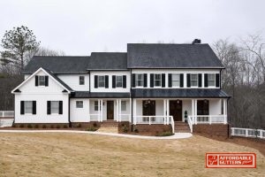 Home With Black Metal Porch Roof