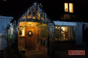 Christmas Lights on Front of House at Night